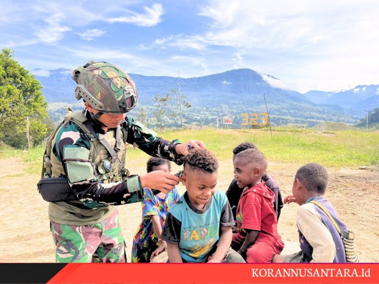 Satgas TNI Peduli Pangkas Rambut Disambut Ceria Anak-Anak Gome