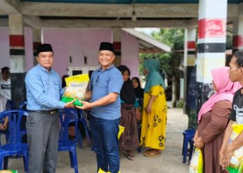 Ketua Patogar Indonesia Parluatan Siregar Salurkan Bantuan Sosial 1500 Sak Beras di Sumatera Utara