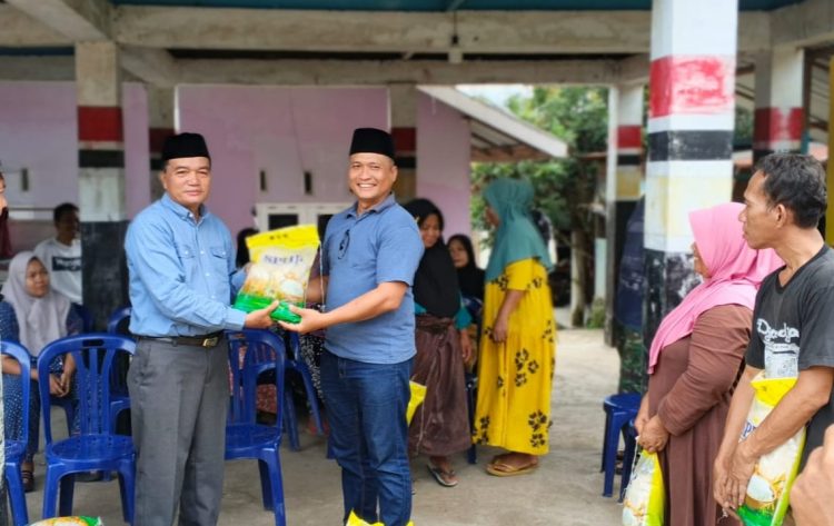 Ketua Patogar Indonesia Parluatan Siregar Salurkan Bantuan Sosial 1500 Sak Beras di Sumatera Utara